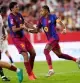 Barcelona's Raphinha, right, celebrates after scoring his side's first goal the Spanish La Liga soccer match between Sevilla and Barcelona in Seville, Spain, Saturday, Sept. 19, 2026. (AP Photo/Jose Breton)